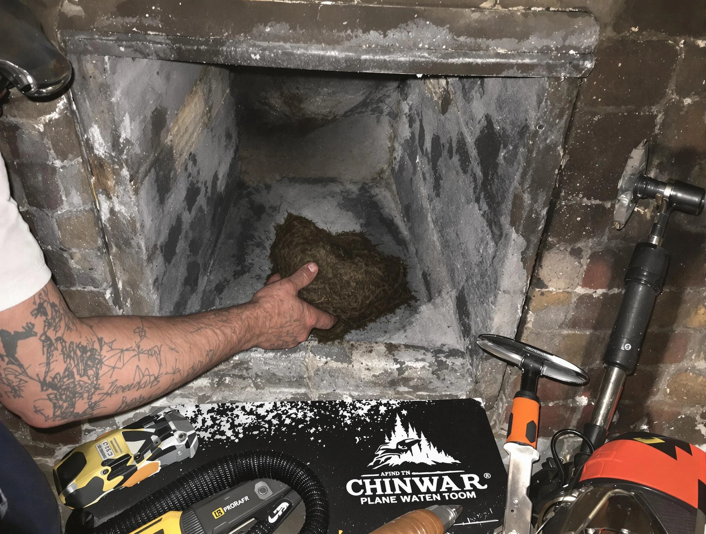 Fayetteville Chimney Sweep safely removing debris and screening chimney in Fayetteville, GA